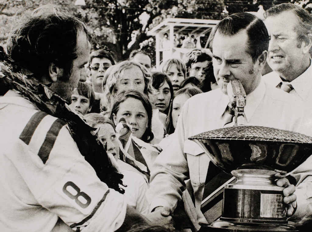 HARD TRAINER: John Brown (left) accepts the Group One premiership cup from the Member for Clarence Matt Singleton after winning the 1975 grand final. HARD TRAINER: John Brown (left) accepts the Group One premiership cup from the Member for Clarence Matt Singleton after winning the 1975 grand final.